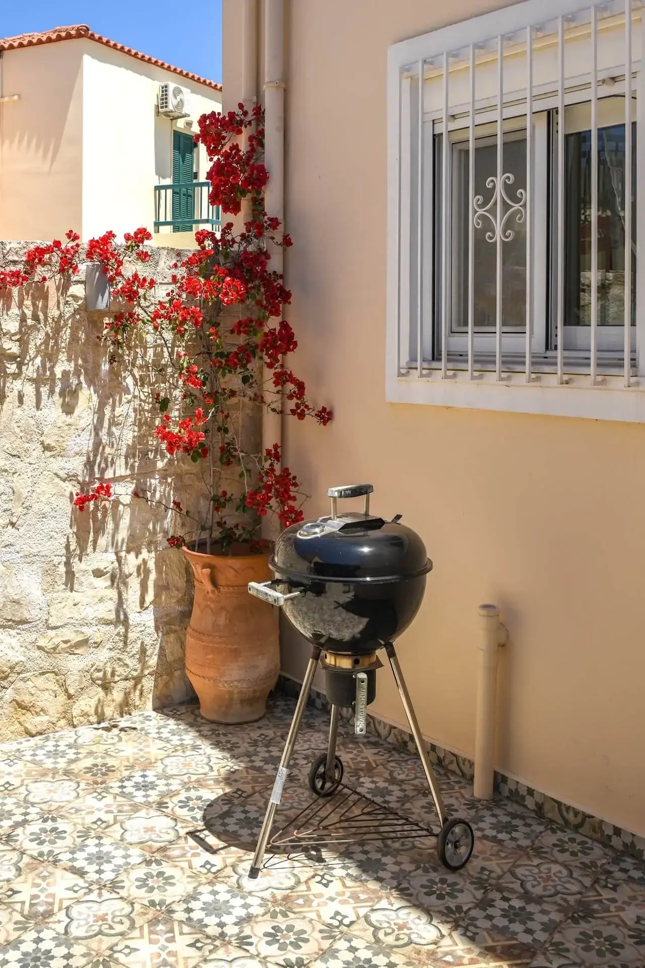 Outdoor dining area with BBQ grill