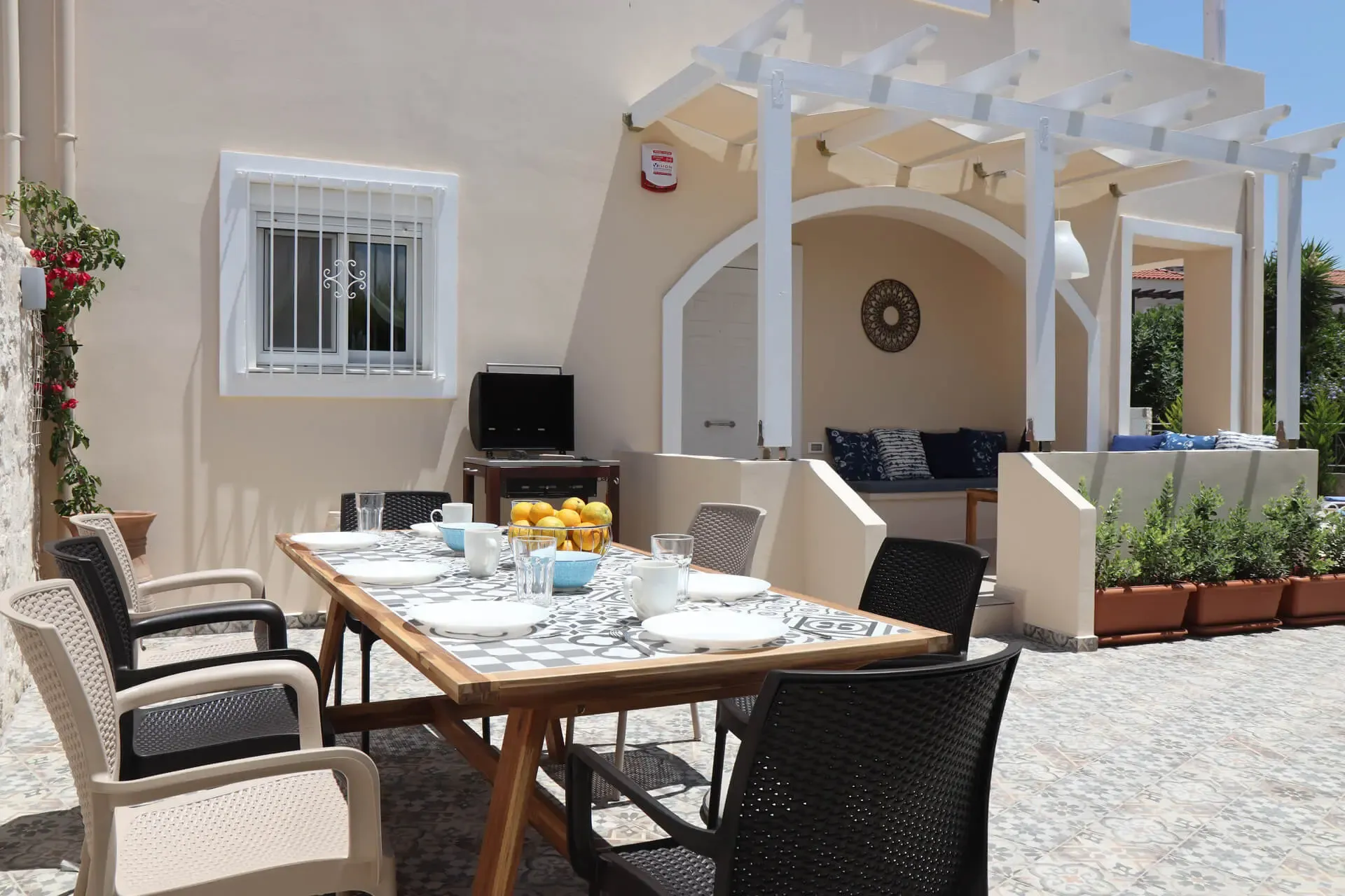 Outdoor dining area with BBQ grill